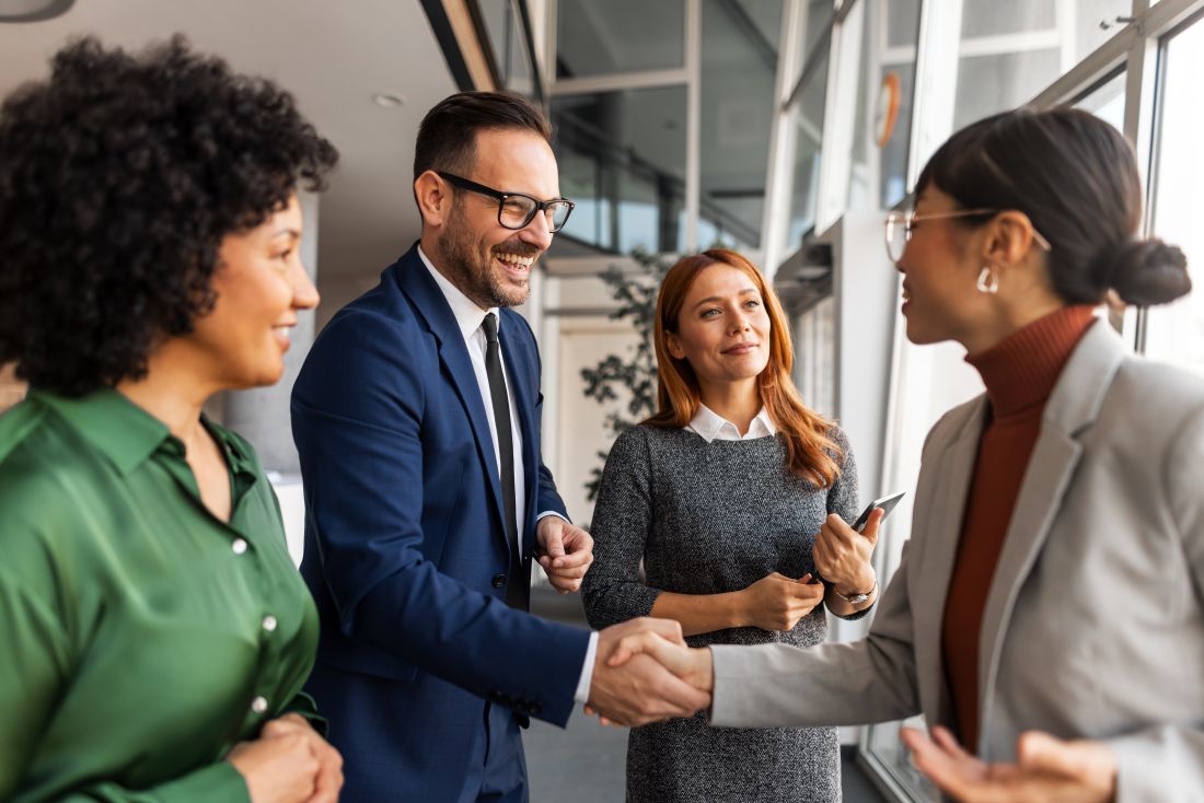 a group of businesspeople networking at a conference