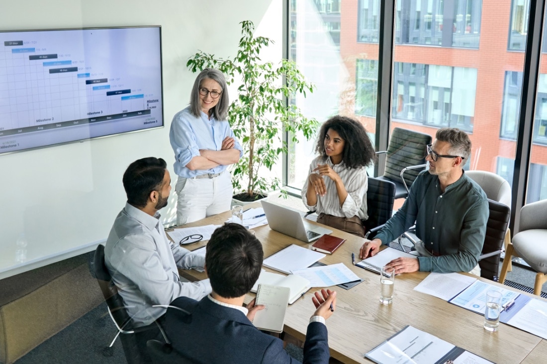 A group of people sitting around a conference table