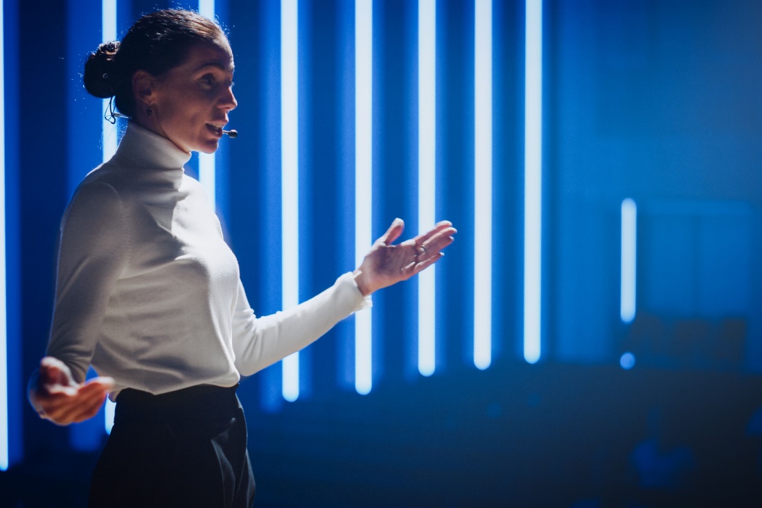 A female speaker on stage