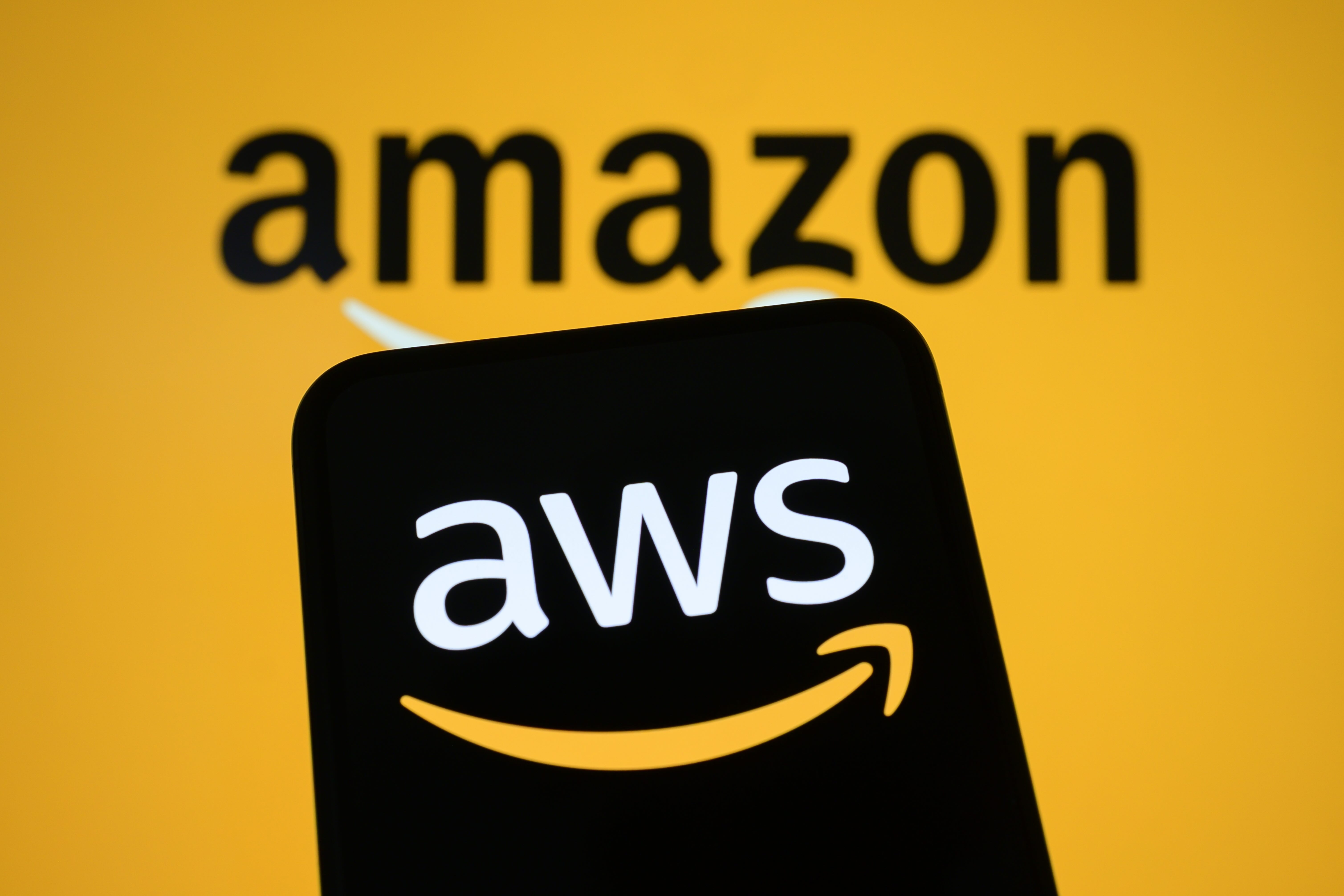 Amazon Web Services AWS logo displayed on screen against Amazon branded background
