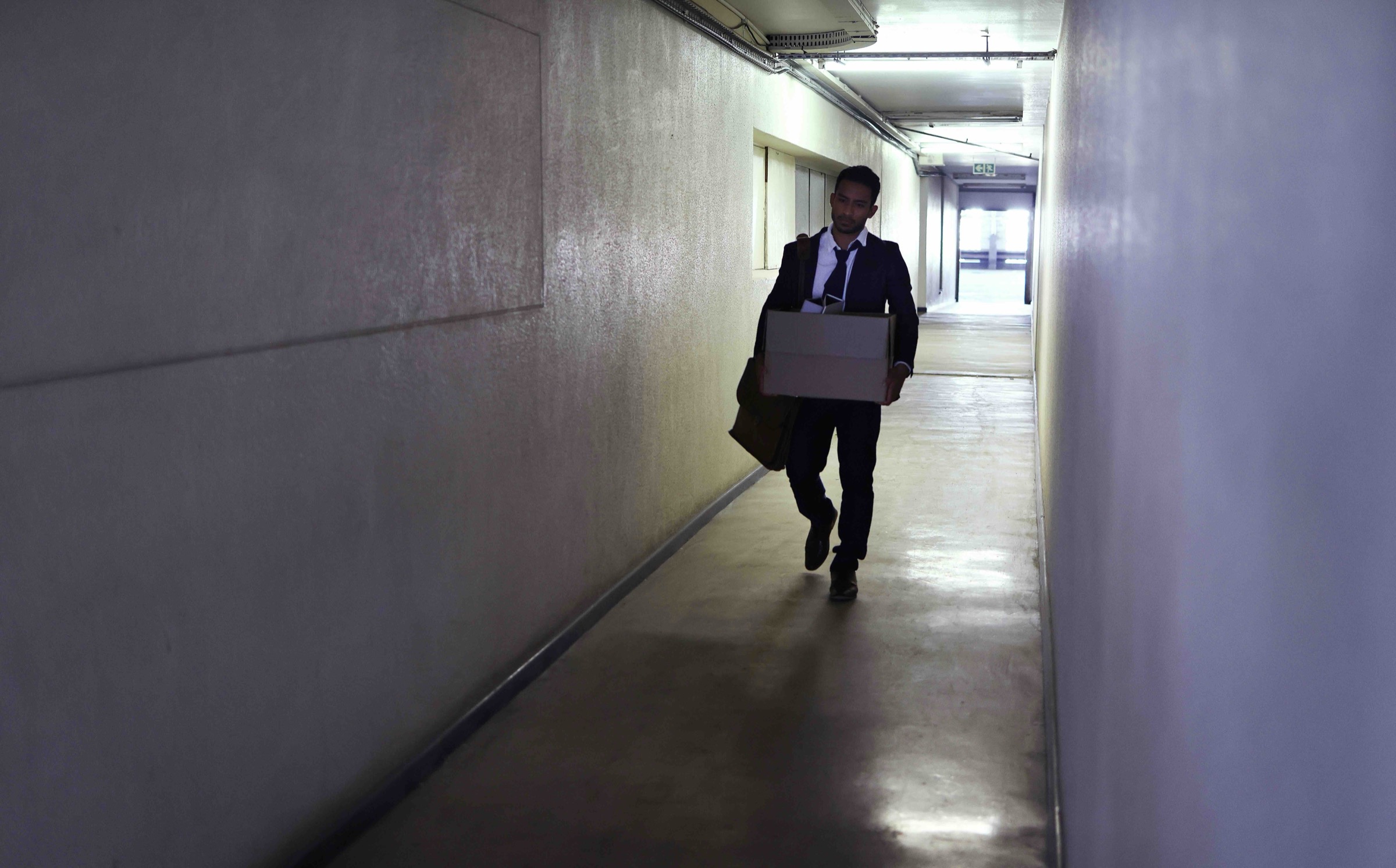 Employee walking out of business after it closed