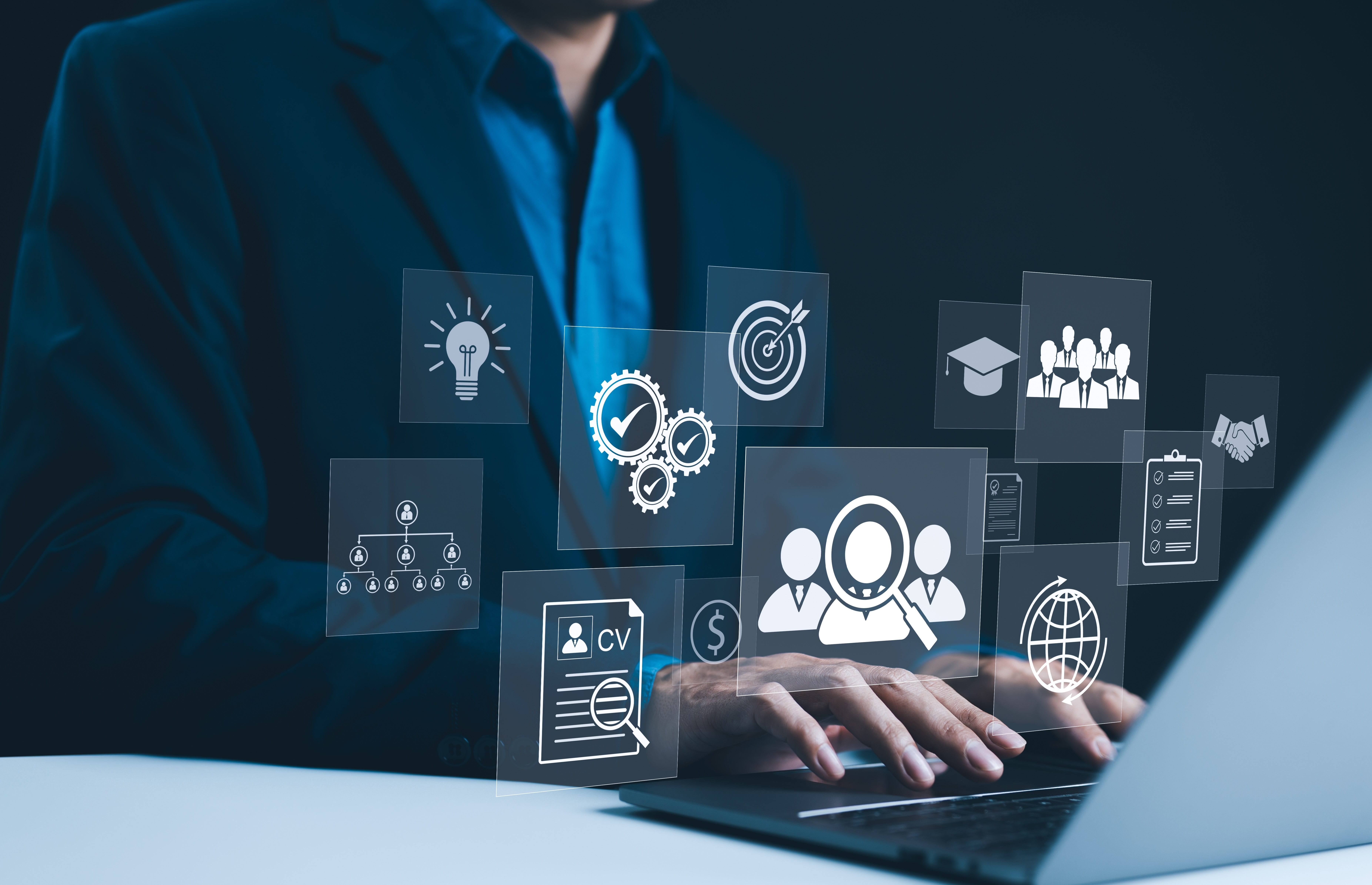 Professional working on laptop with digital icons representing career development