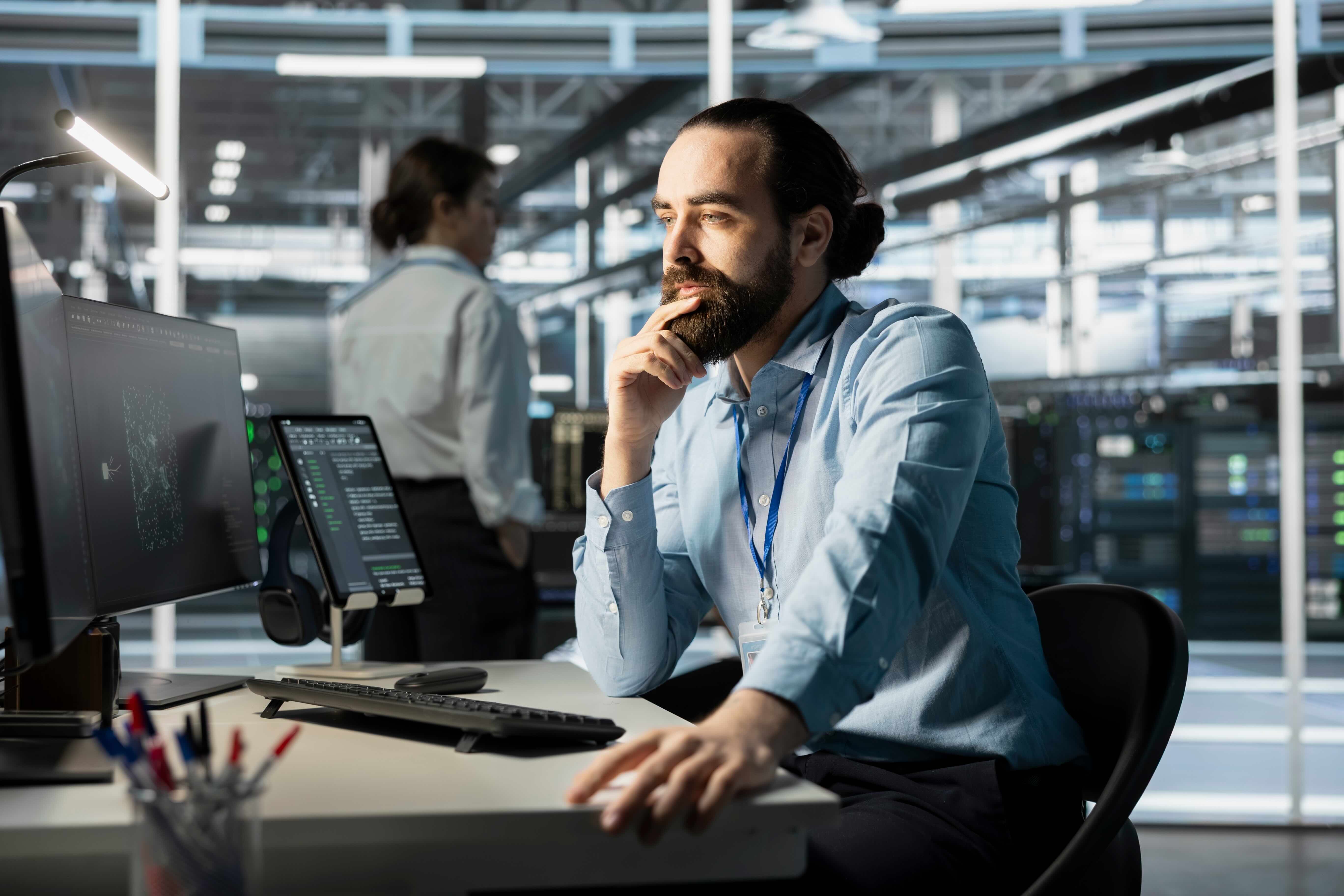 businessman in thought at his desk