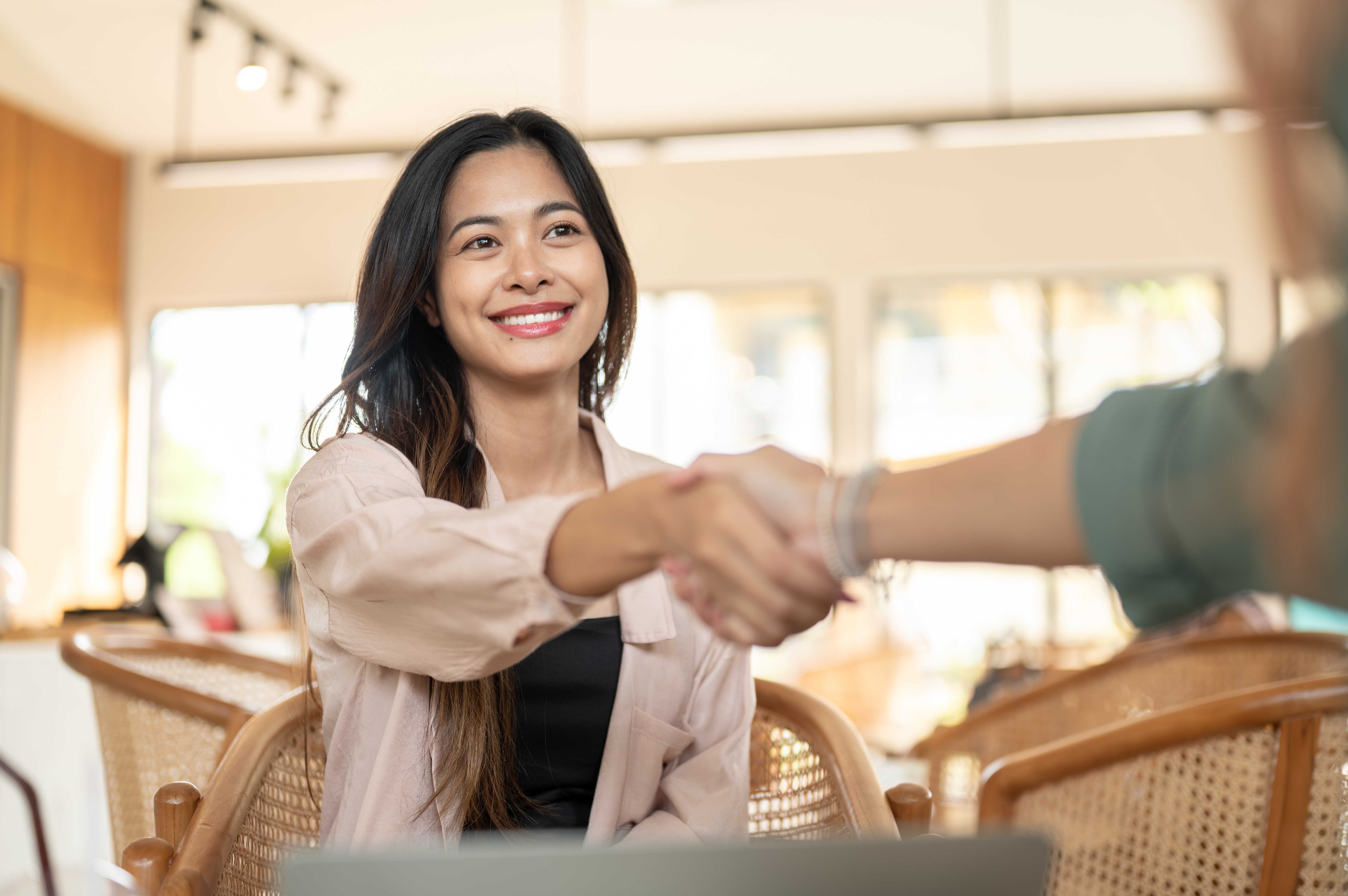 Woman shaking a hand