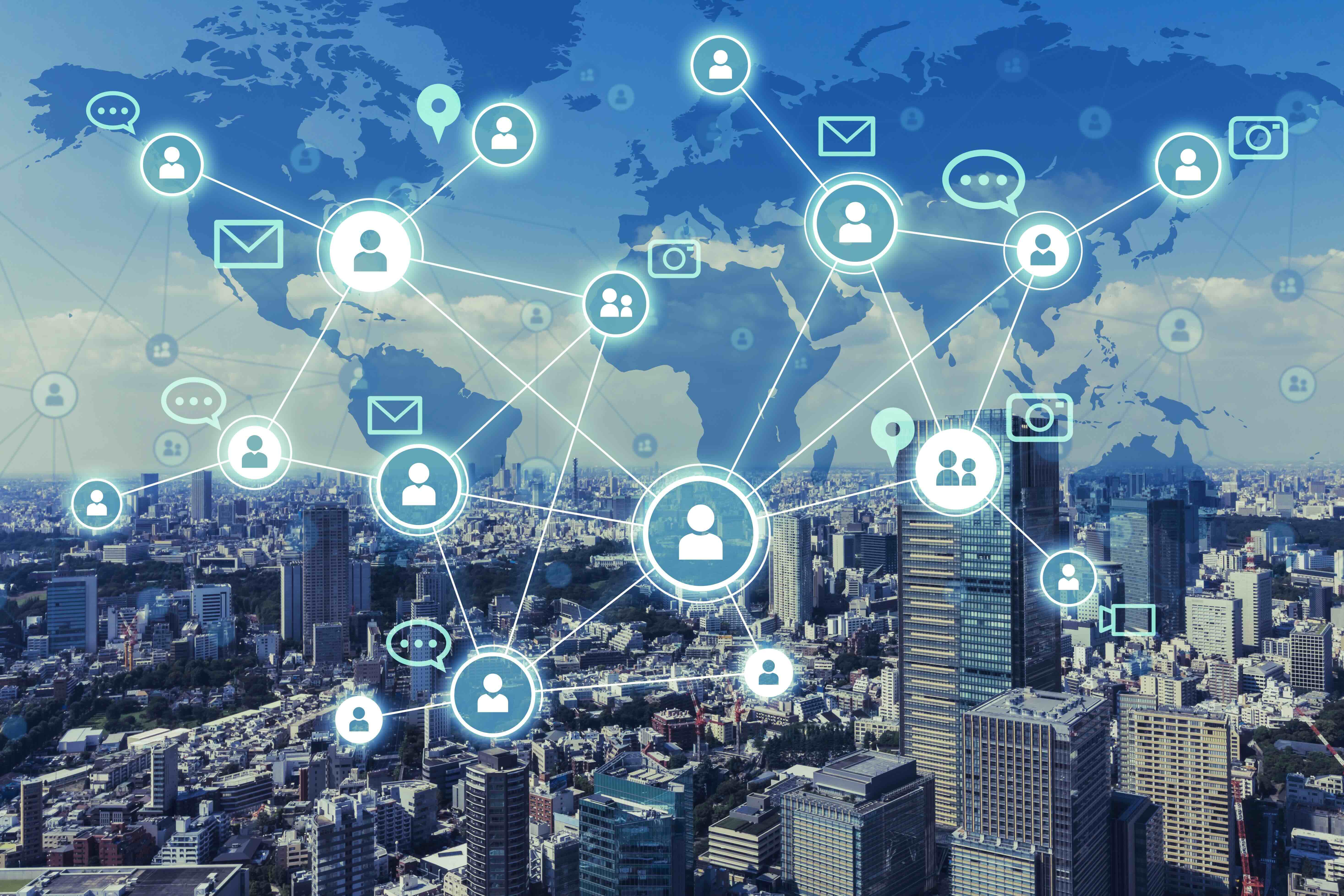 Global network of professional connections overlaid on cityscape with world map showing people icons linked by lines