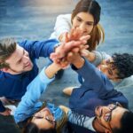 diverse group celebrating the miracle of teamwork