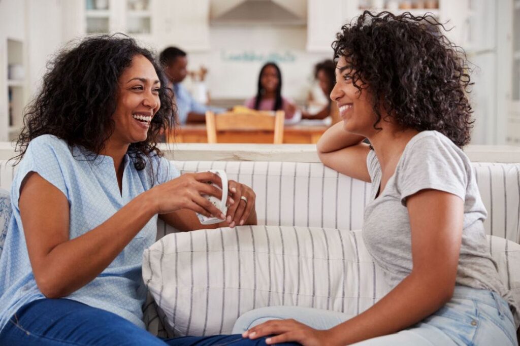 mother chatting with teen daughter to open communication