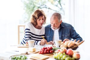 older couple boosting brain health through foods and activity
