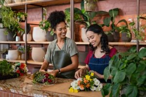 two joyful women finding purpose in owning flower shop