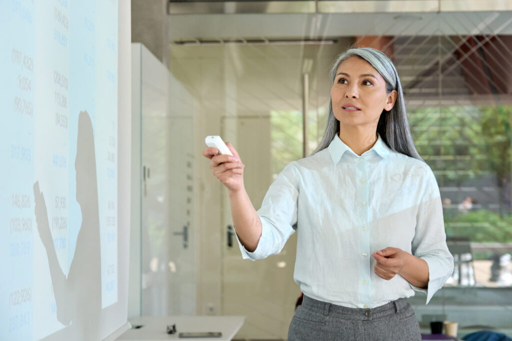 older business woman giving a great presentation