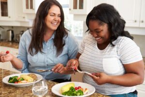 two women boosting mood with happy foods
