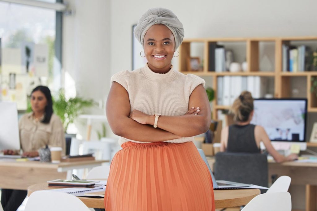 a successful entrepreneur standing in her office