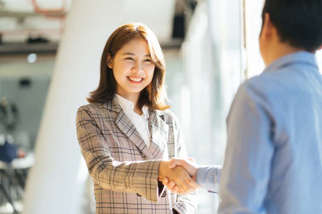 woman being introduced to another person