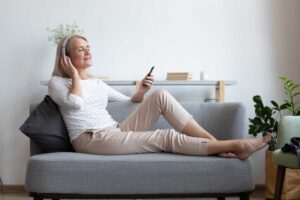 older woman meditating to improve brain health