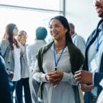 Group of diverse business professionals, businessmen and businesswomen, networking at a conference event.