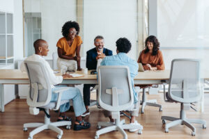 Business people in a boardroom engage in a productive discussion, collaborating on a project