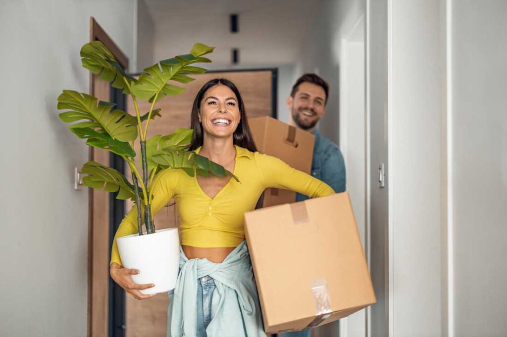 happy couple moving into a new house