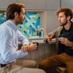 man complaining to colleague about co-worker
