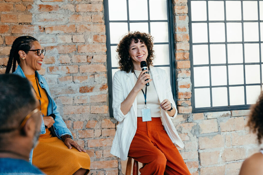 Female speaker in a modern office setting