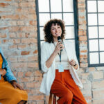 Female speaker in a modern office setting