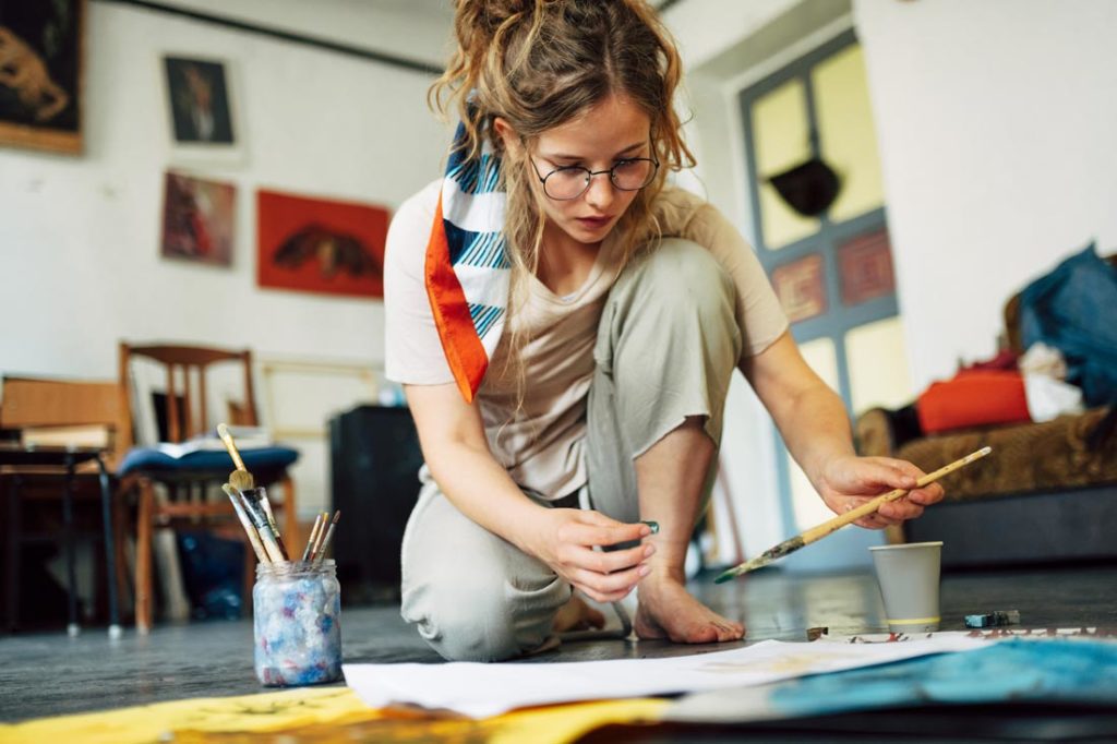 woman being creative painting