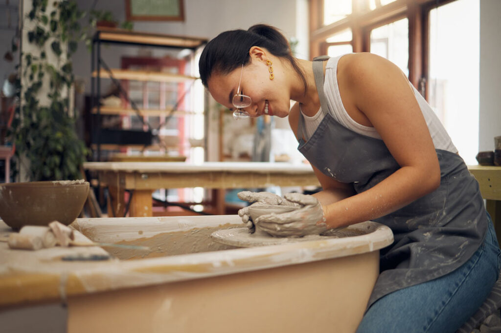 woman learning pottery to be more creative