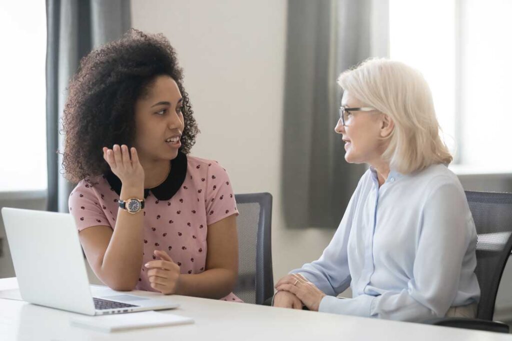 young woman working with mentor