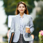 successful woman walking outside