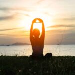 a woman meditating in nature