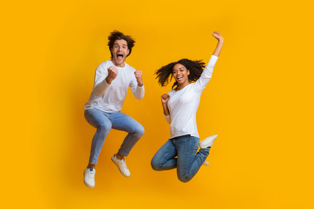 Enthusiastic Couple Jumping in the Air for self inspirational quotes
