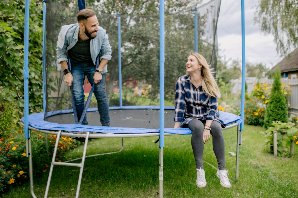 Individuals taking care of themselves by enjoying themselves on a trampoline