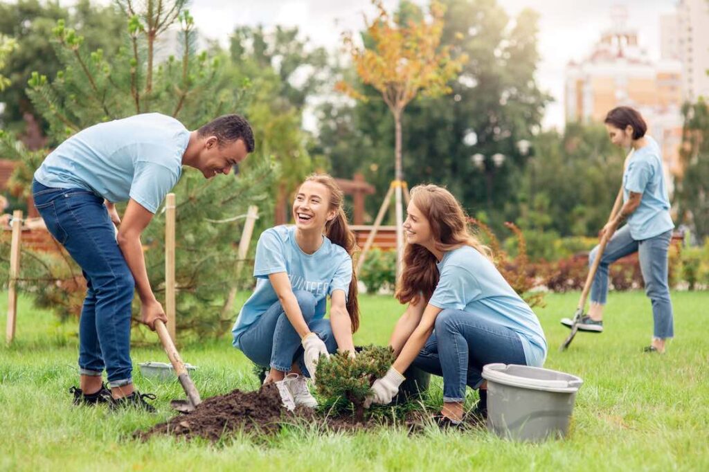 people planting trees to celebrate earth day