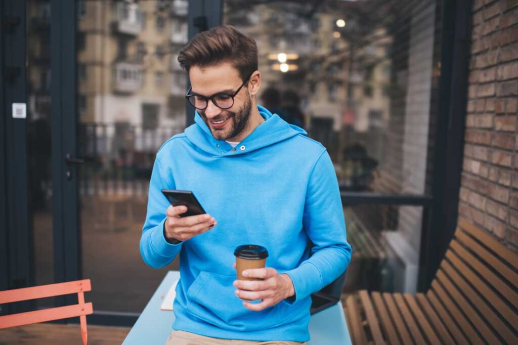 man avoiding news on smartphone