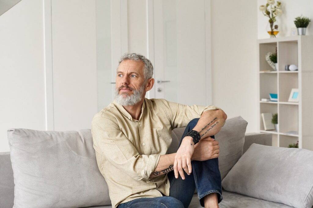 man pondering his life to refocus his energy