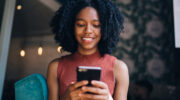 woman using phone to leave an online review