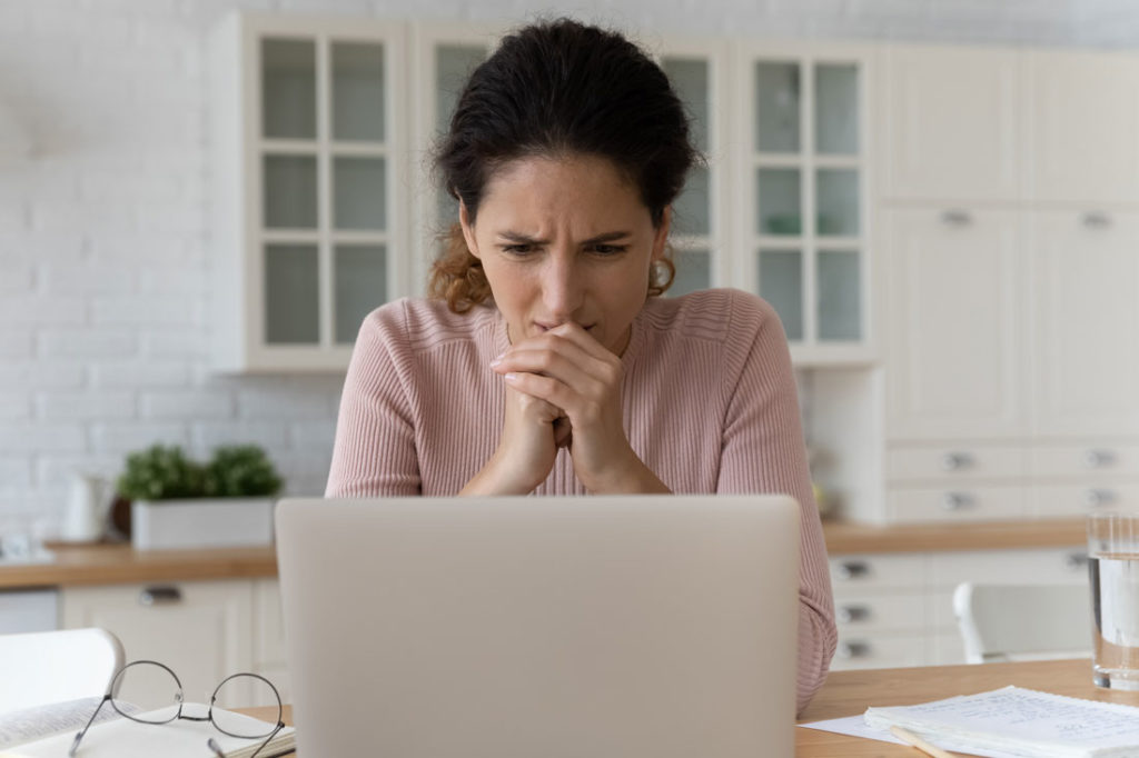 frustrated women writing impulsive decision email