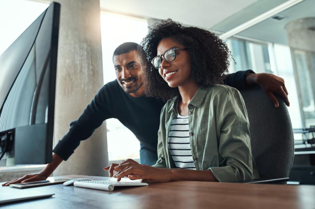 woman and man in mentorship program working together