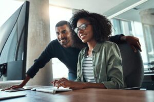 woman and man in mentorship program working together