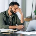 man feeling tired at work