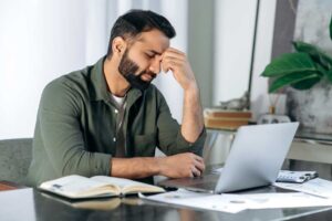 man feeling tired at work