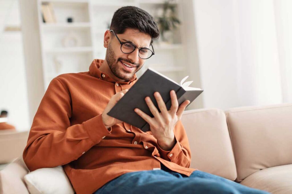 young man making time to read