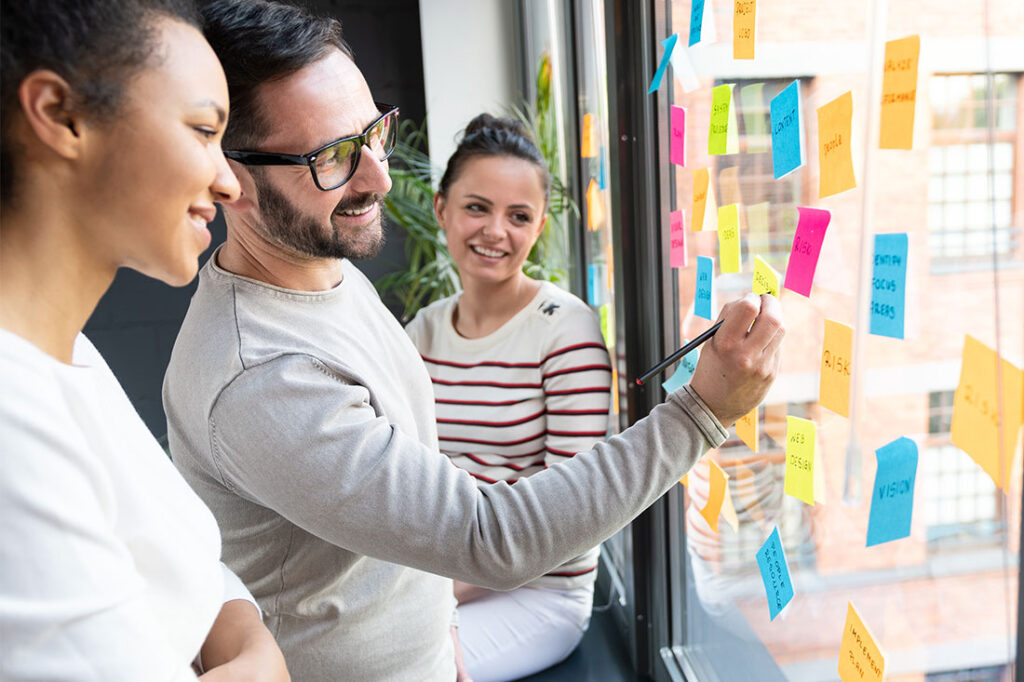 Business people meeting at office and use post it notes to share ideas