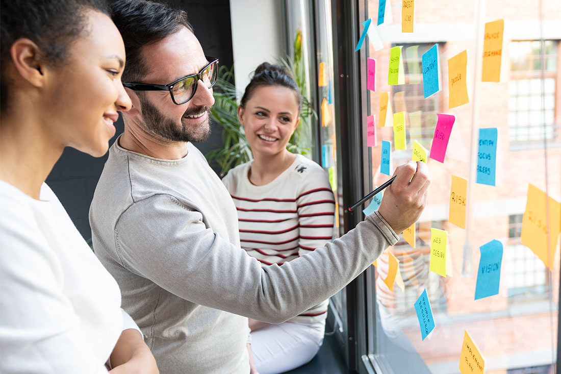 Business people meeting at office and use post it notes to share ideas