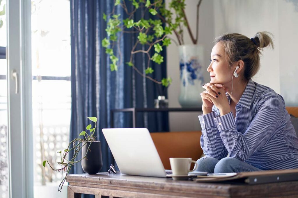 woman at home thinking about dealing with changes