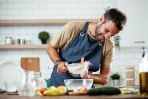 man cooking as a creative personal development activity