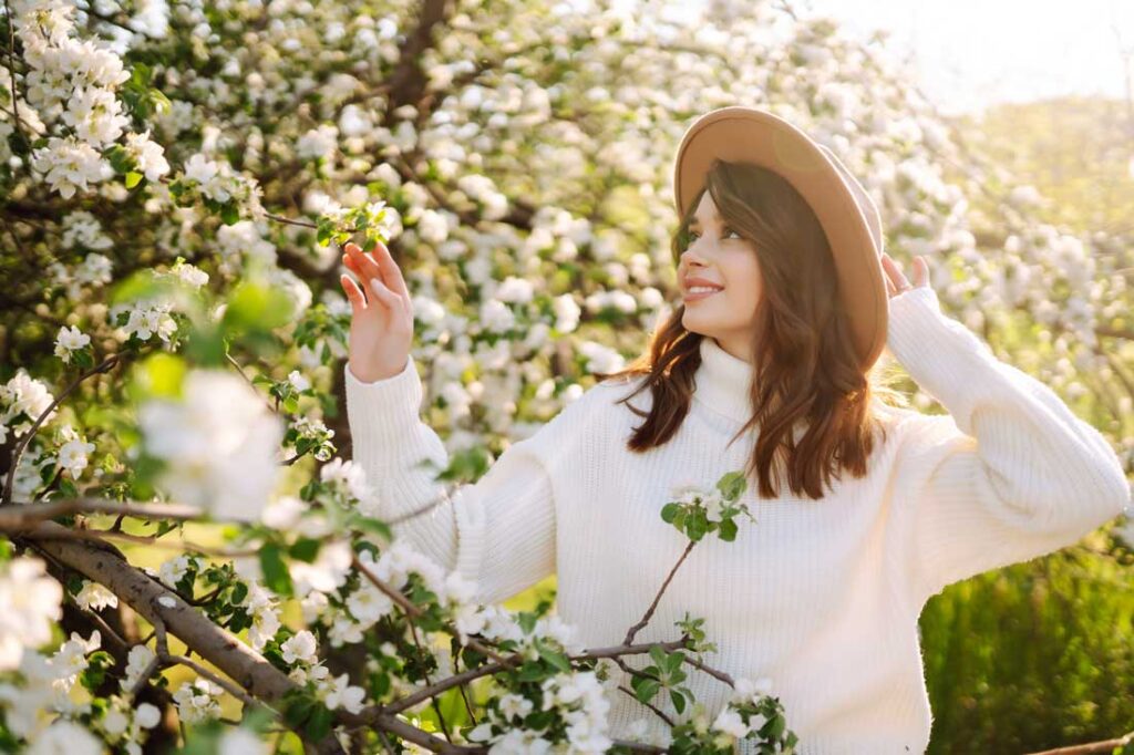 woman smelling spring flowers