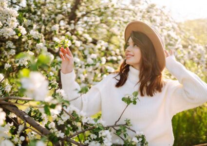 woman smelling spring flowers