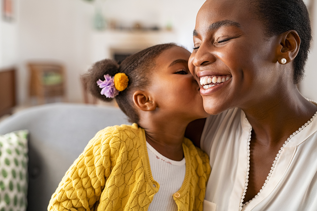 Daughter kisses her mother on Mother's Day