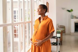 a pregnant woman feeling contentment