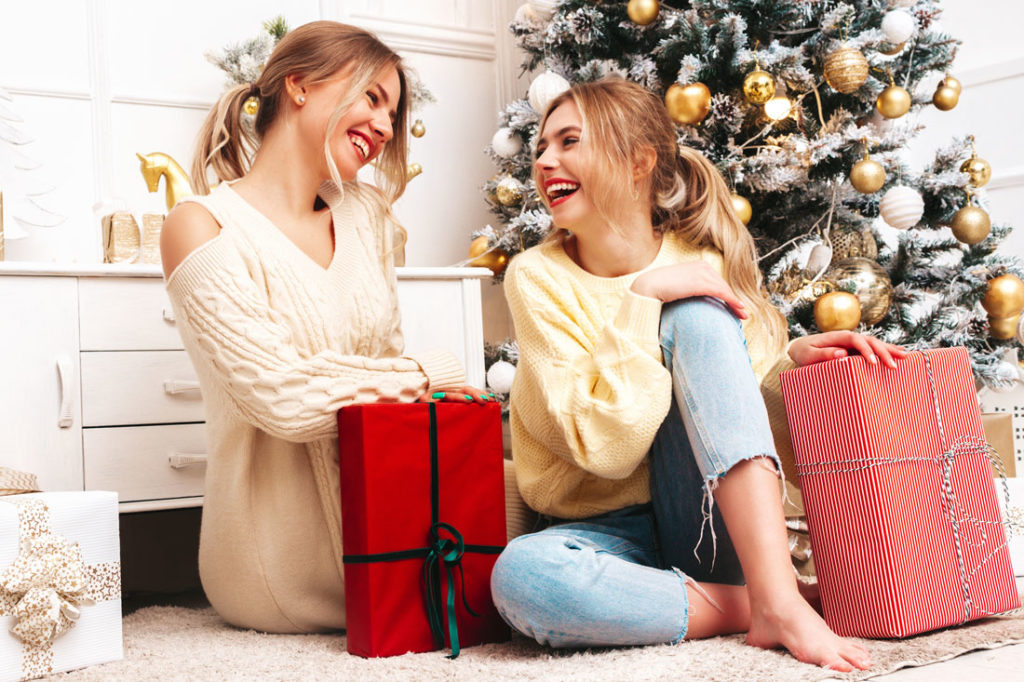 two young women with christmas presents